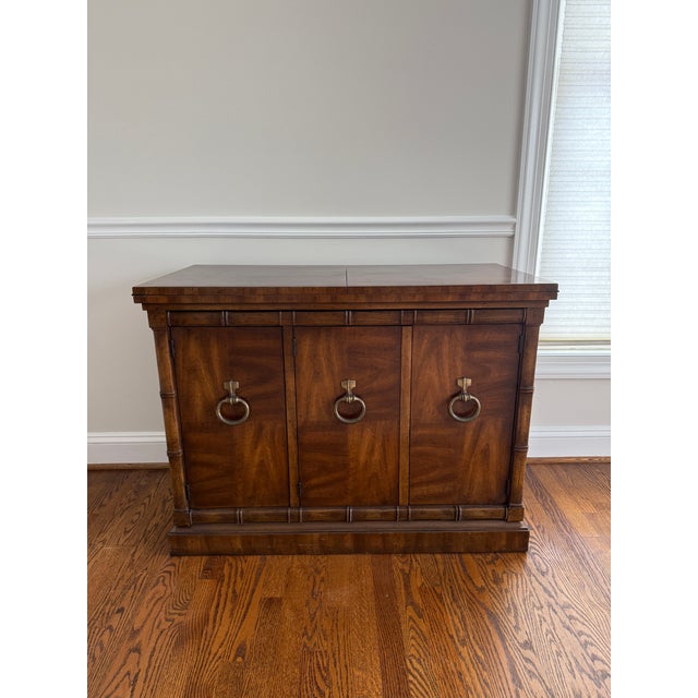 Beautiful Vintage Drexel Heritage Hollywood Regency Style Faux Bamboo Flip Top Server, c. 1970s. This piece features three...