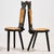 A handcrafted chair with cowhide upholstery from the 1970s. The chair is foldable and has three legs. with some surface...