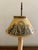 A classic bouillotte lamp rendered in warm brass, distinguished by its tailored yellow and bronze tole shade. The form...