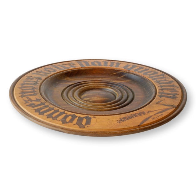 Early 20th century French carved wooden bread board with bold Gothic lettering reading "Donnez Nous Notre Pain Puotidien",...