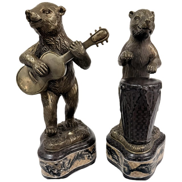 Bring charm, wit, and sophisticated whimsy to your room with this rare, vintage matched pair of sculptural bear figurines...