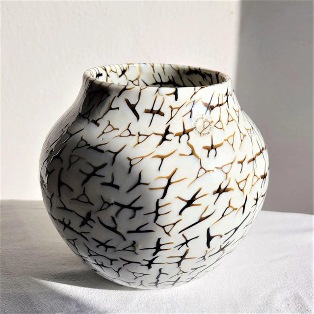 Offered for sale is a magnificent Vaso "coccio" designed by Ludovico Diaz De Santillana, made of lattimo (milky, ivory...