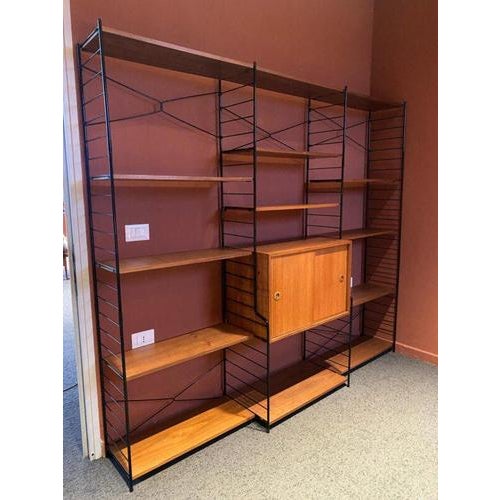 Whb modular wall unit in teak, germany 1970s this exceptional modular wall system (or wall unit), attributed to the...