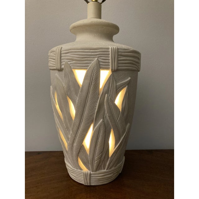 Vintage plaster lamp produced by Pacific Coast Lighting and dated 1998. Features unique relief texture and openings for a...