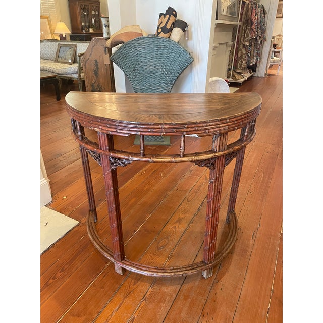 A late 19th, early 20c. nicely scaled late Qing Dynasty demi-lune console table, likely made for export to Western...