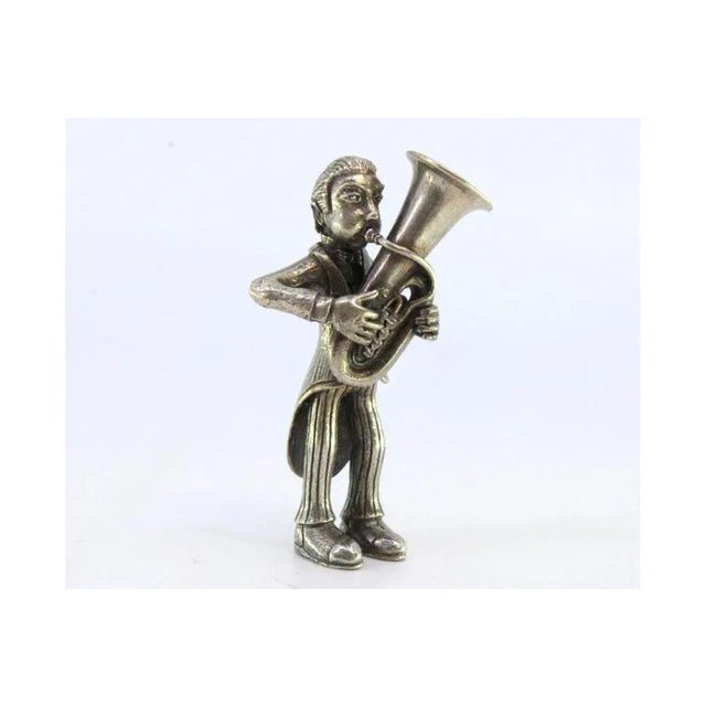 Silver Figure of Musician Playing the Euphonium, in Very Good conditions. Designed 1920 to 1949 This piece has an...
