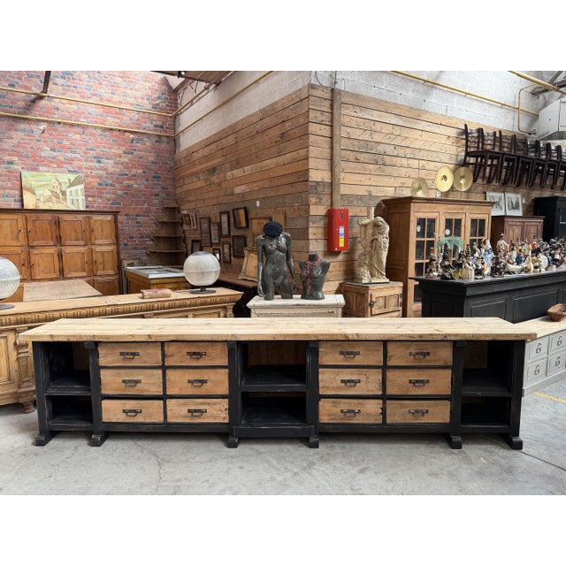 This huge early 20th-century workbench has been fully restored. It features a black-patinated frame, with drawers and a...