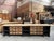 This huge early 20th-century workbench has been fully restored. It features a black-patinated frame, with drawers and a...