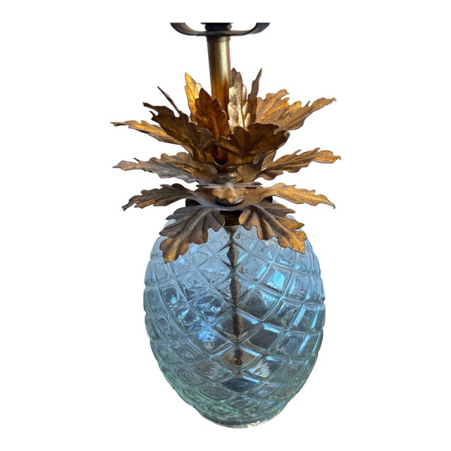 Two pairs of a pineapple glass lamps, a symbol of hospitality, adds a bit of whimsy without being obnoxious.