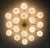Italian flush mount with 18 large glossy white Murano globes mounted on solid brass frame in unlacquered natural brass...