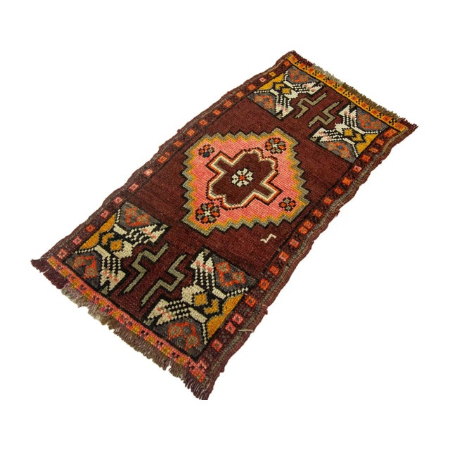 Vintage Handknotted decorative mini rug from Kars region of Turkey. Approximately 45-55 years old. In very good condition.