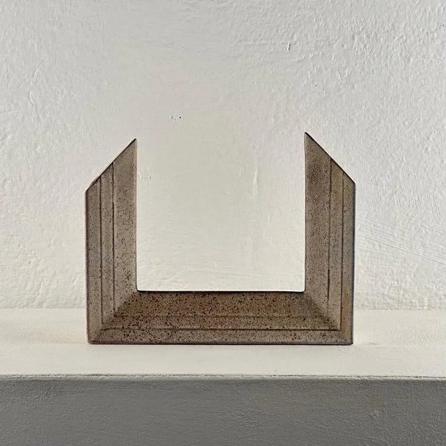 Crafted with meticulous attention to detail, the vase features a bold and geometric design that captures the essence of...