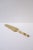 A gold-tone serving piece with bamboo-esque handle, circa 1960s. Piece is stainless steel (as marked) covered in gold gilt...