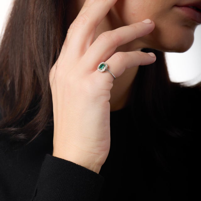 This striking Art Deco cluster ring is a beautiful expression of 1930s elegance, defined by bold geometry and refined...