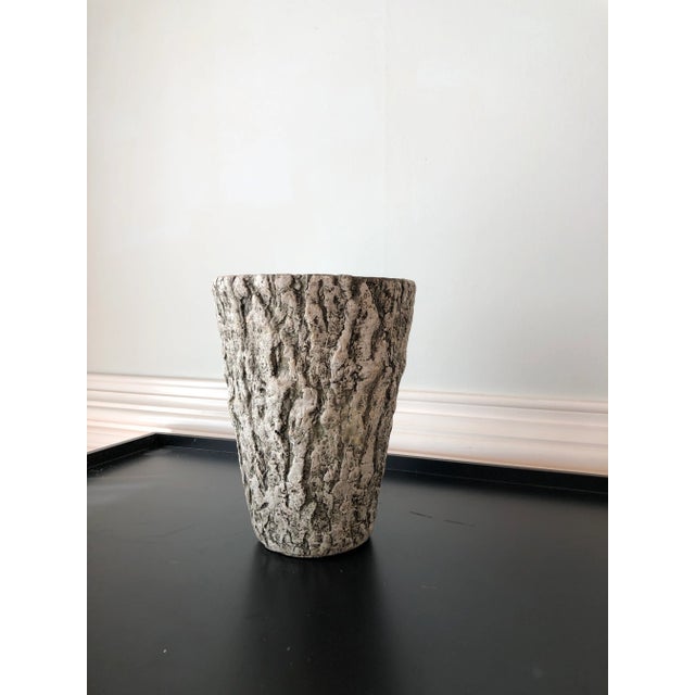 A charming 1960s French faux bois planter, crafted in porcelain and modeled to convincingly resemble carved wood. This...