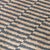 Hand woven jute rug in natural and ocean blue tones. Alternating color pattern creates a rhythmic tile-like effect. Please...