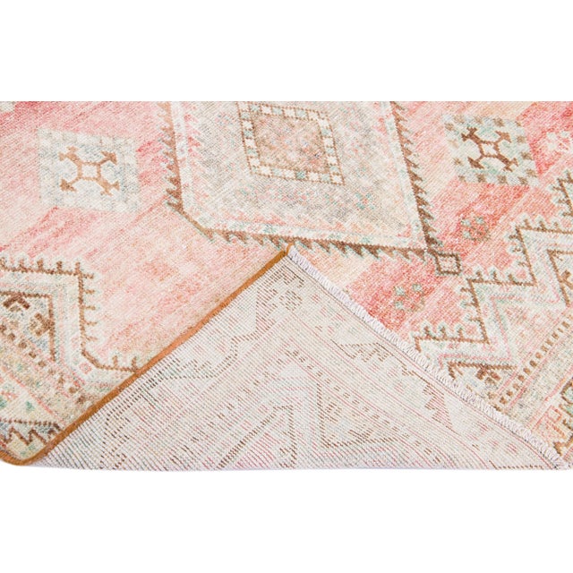 Beautiful vintage Persian Mahal hand-knotted shabby chic wool rug with a pink field. This piece has a beige frame with...