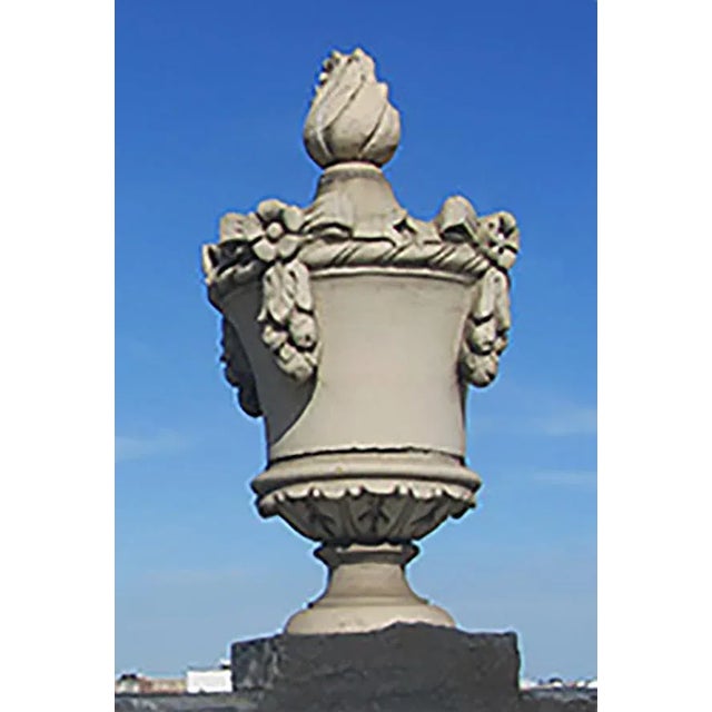 Very rare, monumental Neoclassical style terracotta urn form building finials having a surmounting flame and decorated...