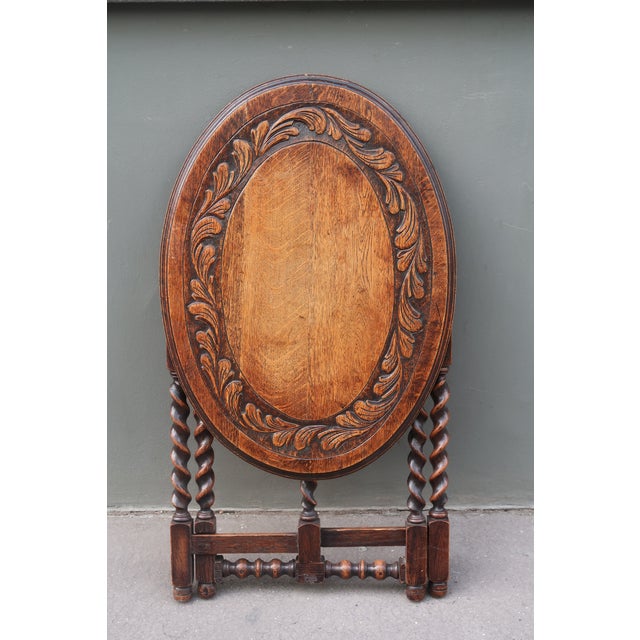 Antique carved tiger oak folding tea coffee table Charming antique oak folding ‘tea’ table Large tiger oak oval top has...