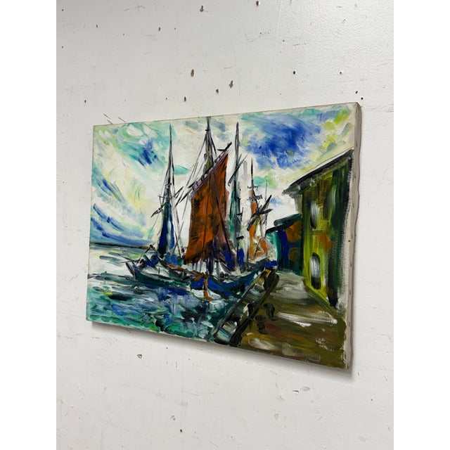 Design Plus Gallery presents a Vintage Harbor Painting. This acrylic on canvas composition depicts sailboats gathered...