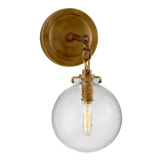Thomas O'Brien for Visual Comfort Signature Katie Small Globe Sconce in Hand-Rubbed Antique Brass with Seeded Glass For Sale