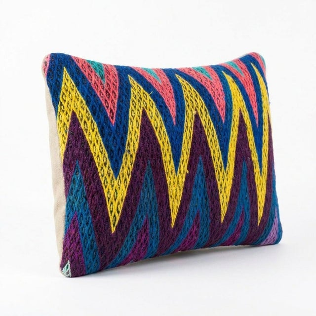 This beautiful 16'' x 24'' pillow cover was made from an authentic Turkish rug. Bright colors of wool adorn the front of...