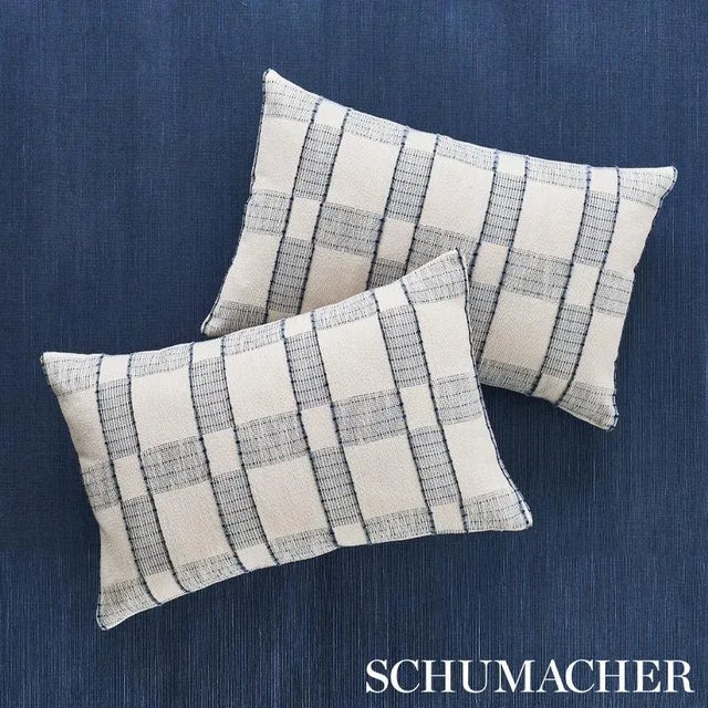 The asymmetrical design and unexpected fringe detailing show the hand of the maker in this plaid. Suitable for a range of...