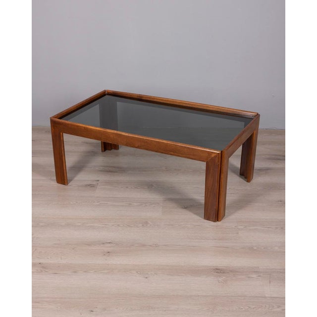 Coffee table with walnut wood structure and smoked glass top, Italian design, 1970s.