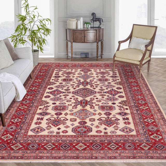 Enhance your home with this exquisite hand-knotted Super Kazak rug, crafted from fine hand-spun wool and dyed with all-...