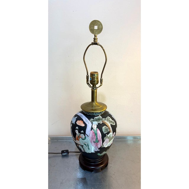 1960s-70s matte black ceramic hand-painted Chinese table lamp w/ wood base and brass at neck/top. Excellent condition....