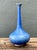 This vintage tall blue ceramic vase brings a rich cobalt hue and classic bottle form to a room. Its wide, bulbous base...