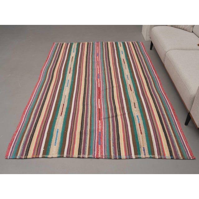 Vintage Hand-Knotted runner rug is a semi-antique vintage area rug. The '70s Eastern region of Anatolia's unique rug is...