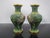 Pair of miniature Chinese cloisonne vases in green enamel with gilt accents and colorful floral motif. Each measures 4"...
