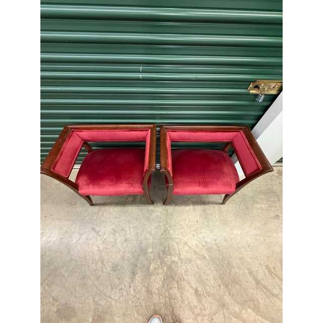 A fabulous pair of vintage petite tub chairs featuring sculptural wood frames and rich raspberry-red velvet upholstery....