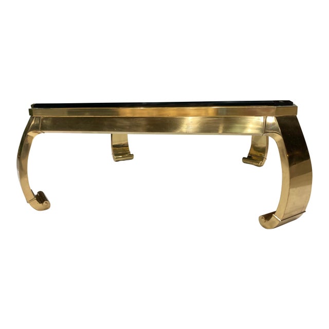 Asian influenced brass ming legged coffee table having original 3/4” cut square corner glass top with chamfered edge,...