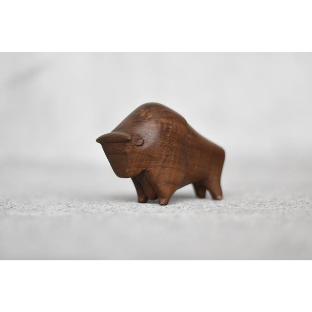 This wooden figurine of a Bison was made in Denmark during the 1960s. Hand-made of high-quality teak wood with clearly...