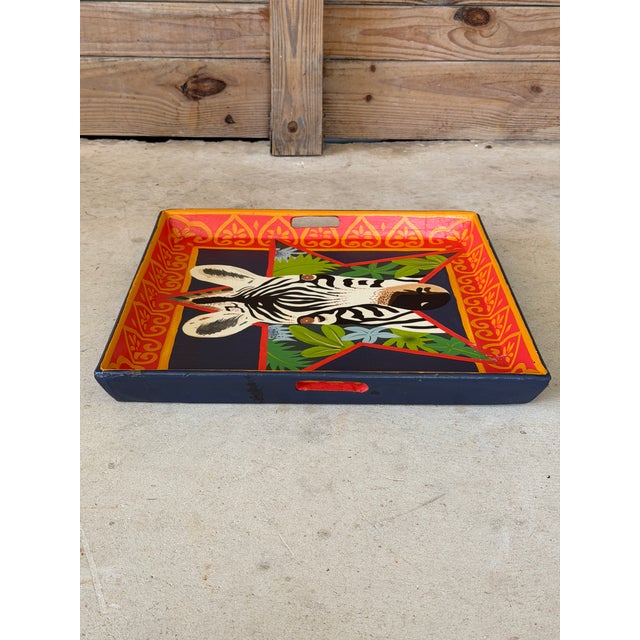 A wonderfully colorful vintage papier-mâché decorative tray featuring a whimsical zebra surrounded by tropical foliage...