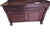 A handsome vintage solid maple Early American sideboard featuring classic Colonial styling with rolled feet, a raised...