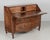 An 18th Century Louis XV style Italian scriban or slant front desk. Made of solid walnut with serpentine front, raised...