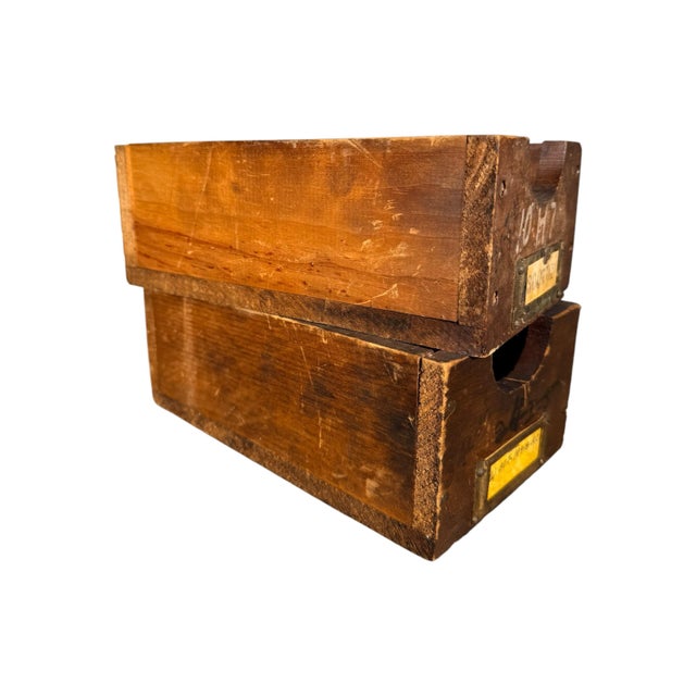 A rare and ornate pair of vintage wooden tool cabinet drawers, including the original drawer labels. These beautiful...