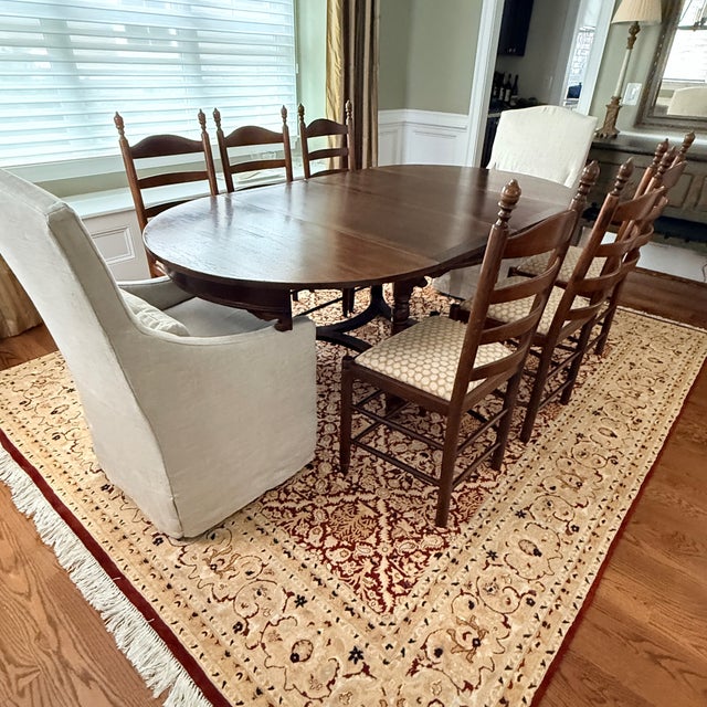 Antique Belgian Dining Table circa 1900 This stunning oak table easily goes from round to oval with the addition of one...