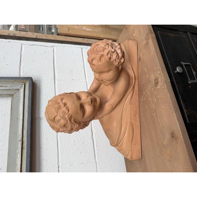 A terracotta sculpture from the 1930s, signed by the artist Ugo Cipriani (1887–1960). This work depicts a mother’s...
