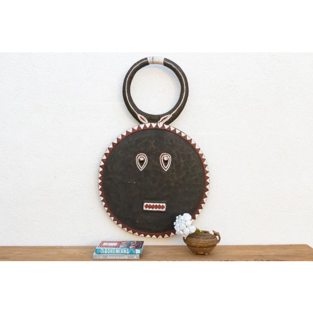 A charming African art piece, this Kple Kple mask belongs to the Goli mask group and is a symbol of fertility in...