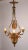 This regal and ornate doré bronze chandelier, done in the neoclassical style, heavily features elements of classical...