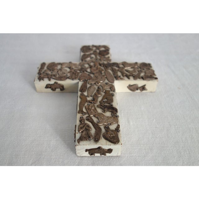 Magnificent and authentic Milagro cross by the late Mexican artisan Estela Ogazón (1966-2009). Known for her dense, heavy,...