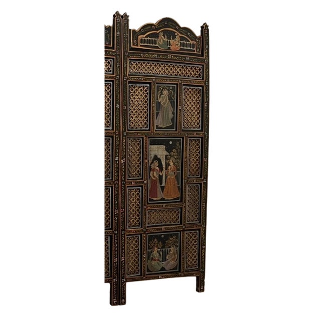 A wonderful vintage Indian three panel screen with carved crests and turned short spindles, The screen with open work and...