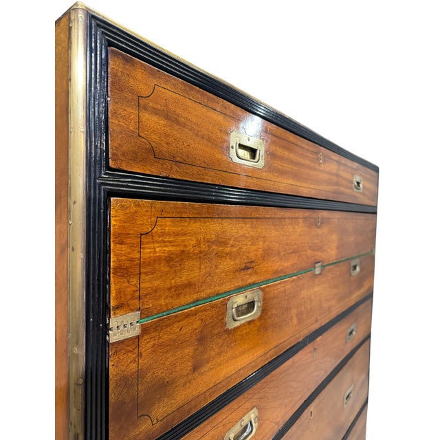 A fine mid-19th century English campaign chest in richly figured mahogany, retaining its original brass recessed hardware....