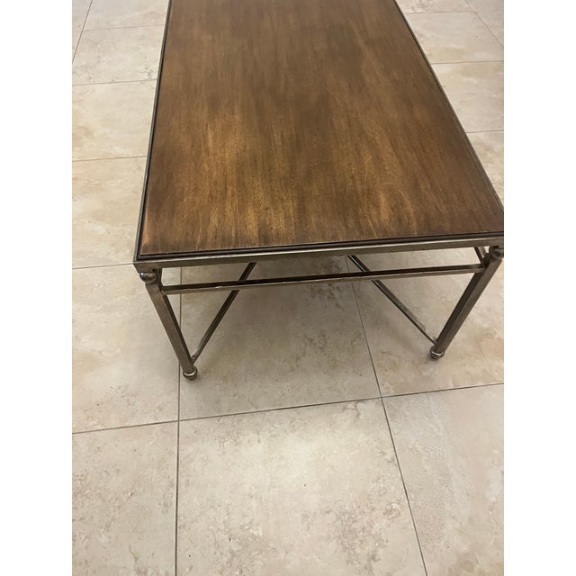 This amazing piece from Baker Furniture has an Industrial Elegance: It blends a warm, textured wood top with a structural...