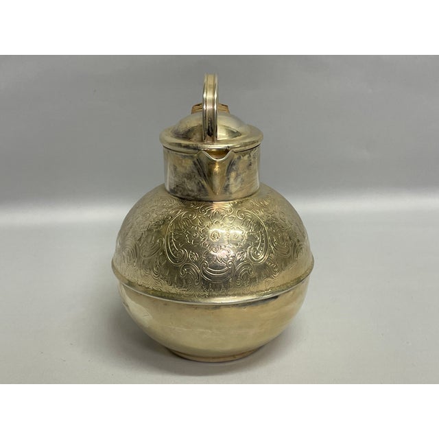 A silverplate creamer inspired by the Isle of Guernsey milk jugs. This 1.5 pint pot was made in England and features a...