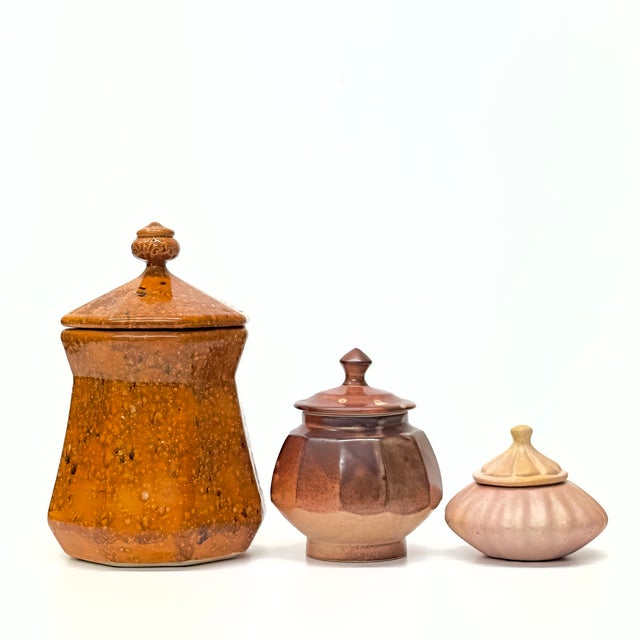 Brown-lidded containers, group of 3. A stunning set of lidded ceramic and stone containers in different shades of brown....